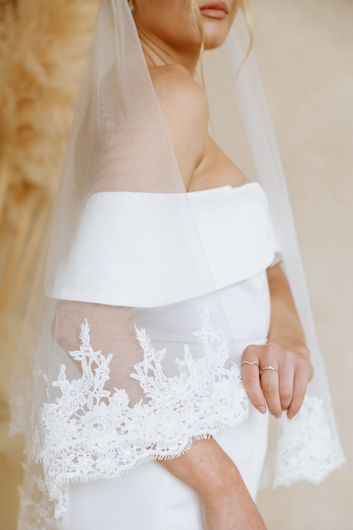 A close up photo of a wedding veil with eyelash lace trim