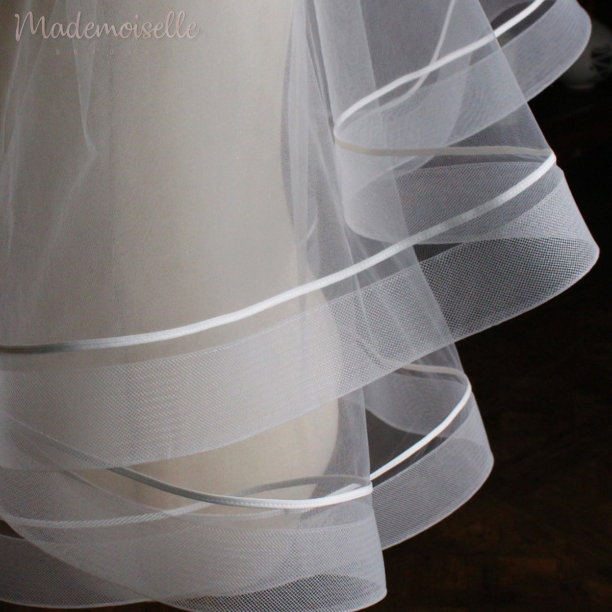 A luxurious wedding veil with horsehair trim, showcasing intricate craftsmanship and timeless beauty.
