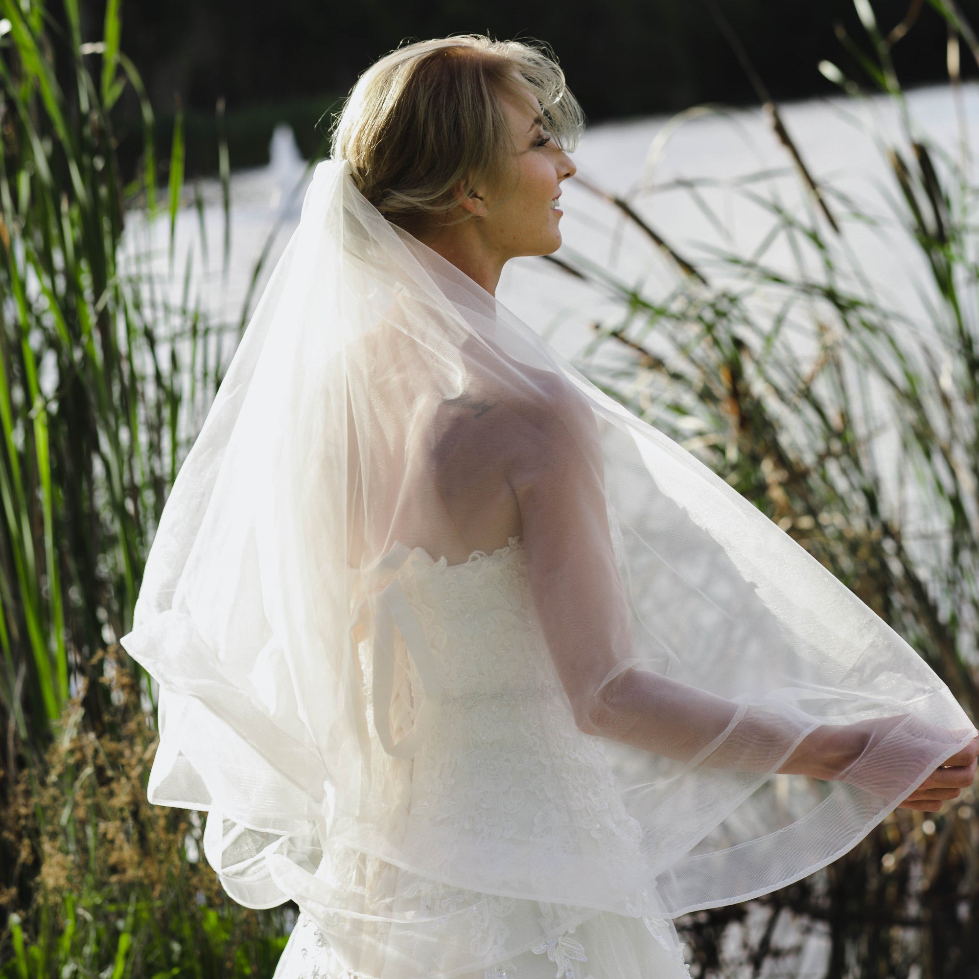 A model wearing the Abigail two tier wedding veil
