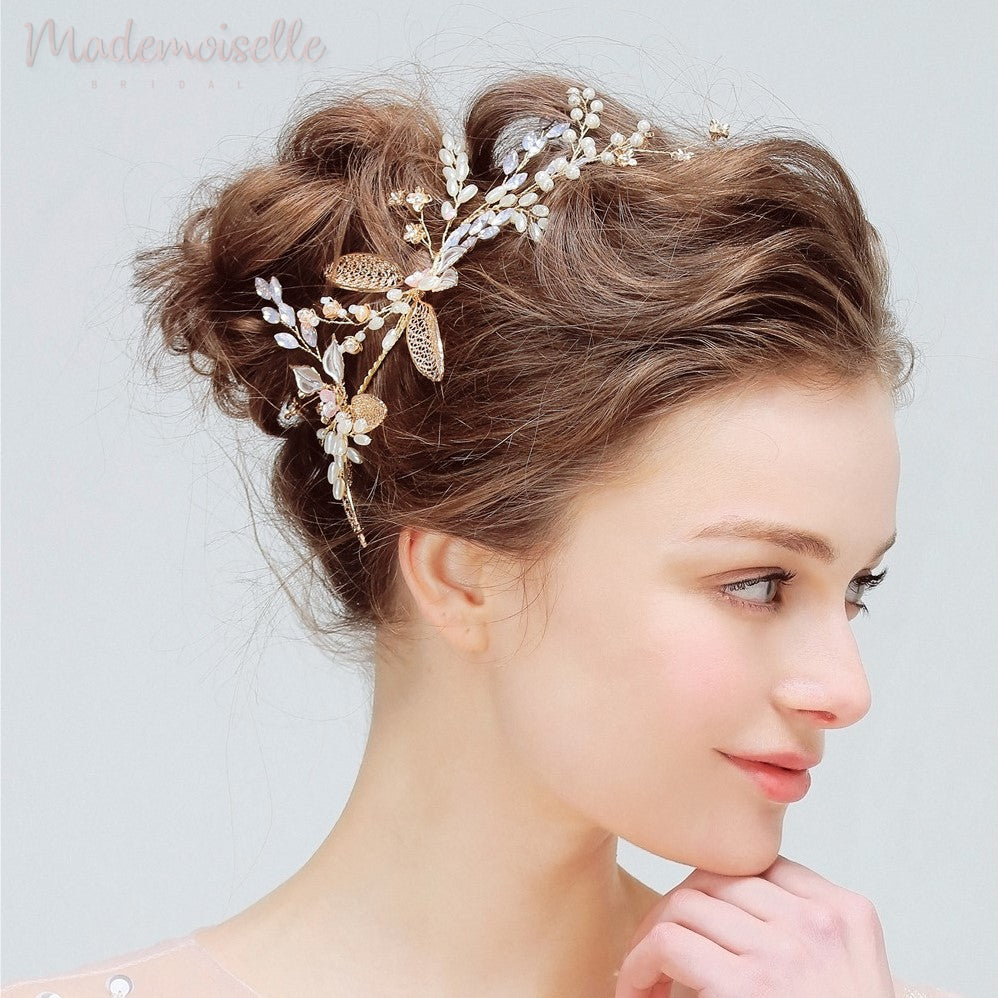The bride showcases a stunning gold headpiece embellished with flowers, adding a touch of beauty to her special day.