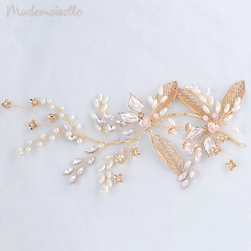 The bride showcases a stunning gold headpiece embellished with flowers, adding a touch of beauty to her special day.